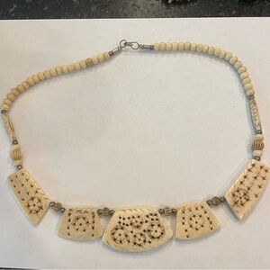 Carved camel bone necklace